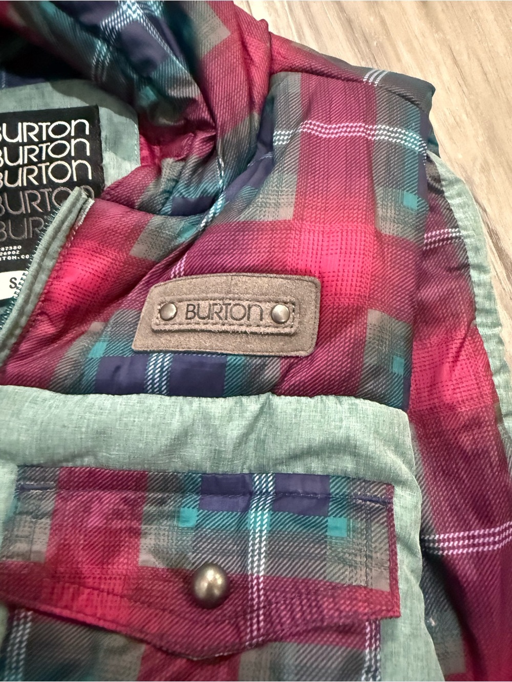 Burton Dryride Women’ Plaid Puffer vest in Pink and Teal Accents